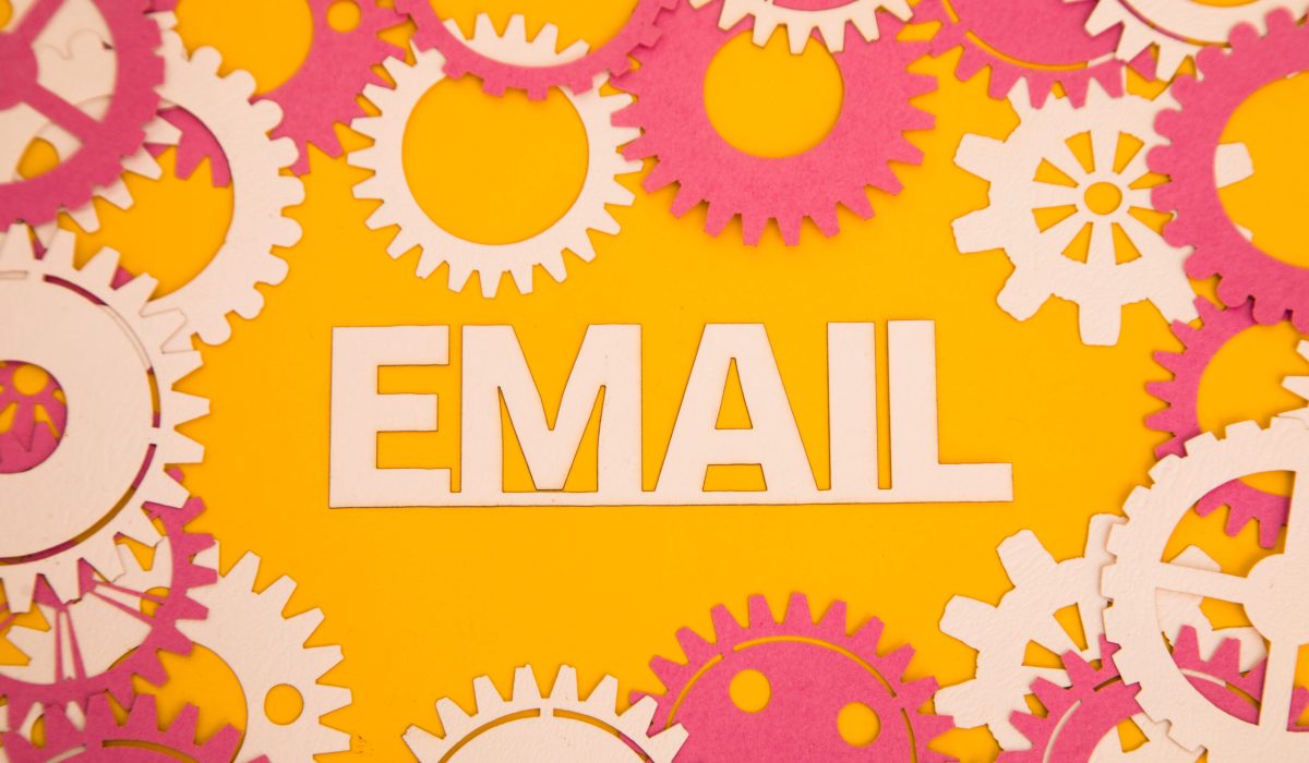 Paper inscription on the yellow background of paper gears